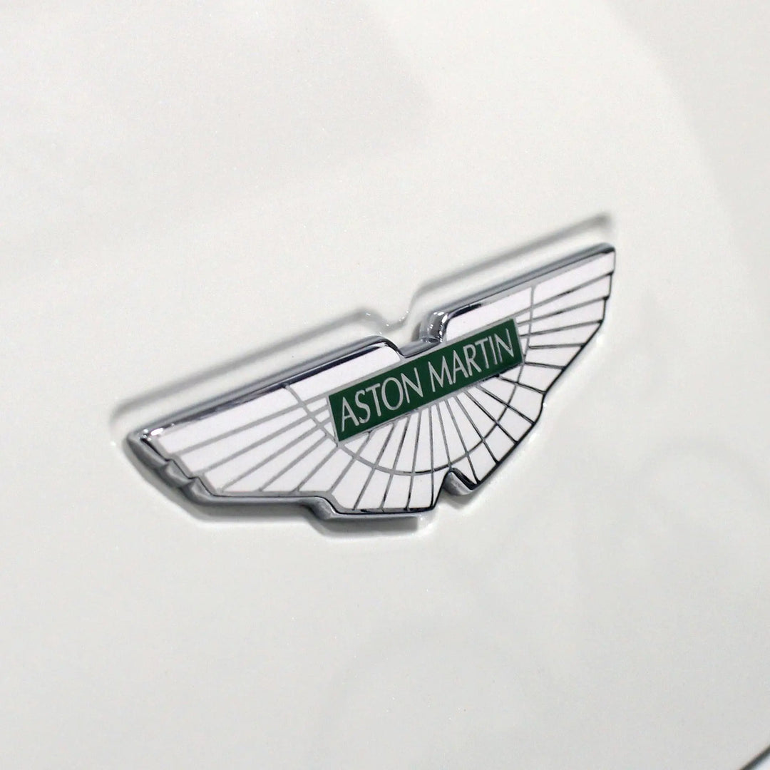Aston Martin badge on a white car. 