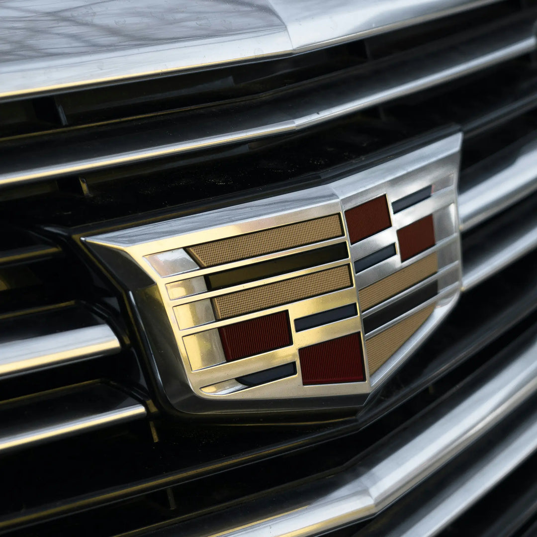 Cadillac badge on a silver car. 